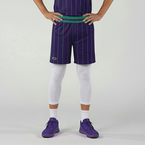 Person wearing purple pinstripe shorts, white leggings, and purple shoes on a light gray background
